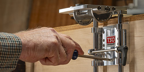 StaySquare guide rail hinge screwed to the wooden skirt of a shop-built MFT table